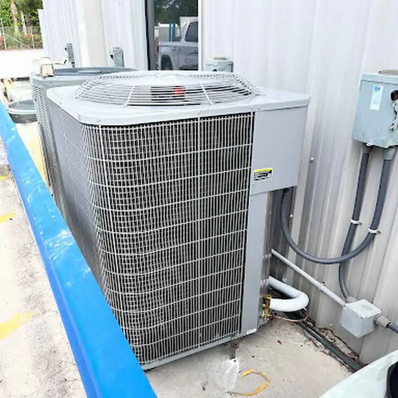 Commercial AC condenser beside a metal building