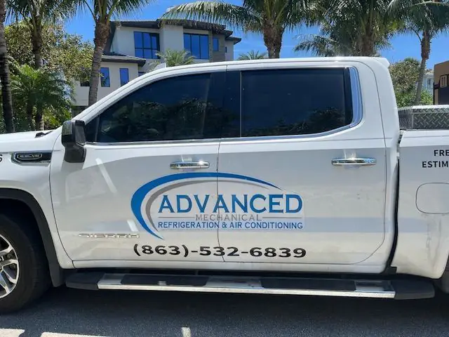 Advanced Mechanical work truck lettered with the logo, phone number and free estimates